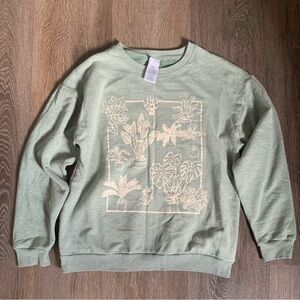 Light green sweatshirt crewneck with plant design